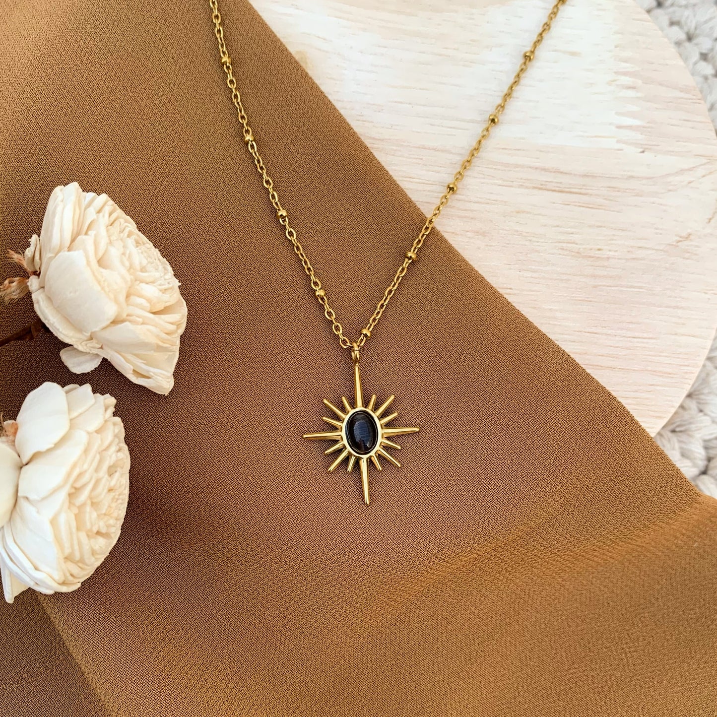 Sunray style black chain pendant