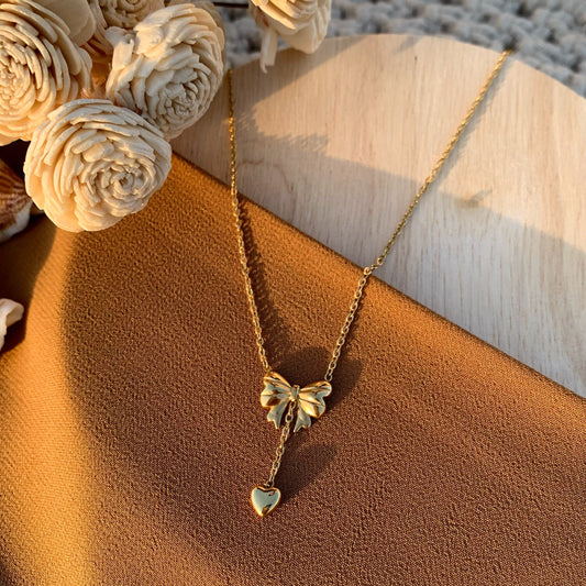 Bow hanging heart chain pendant
