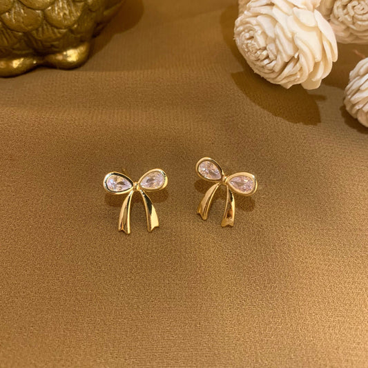 Bow golden charm